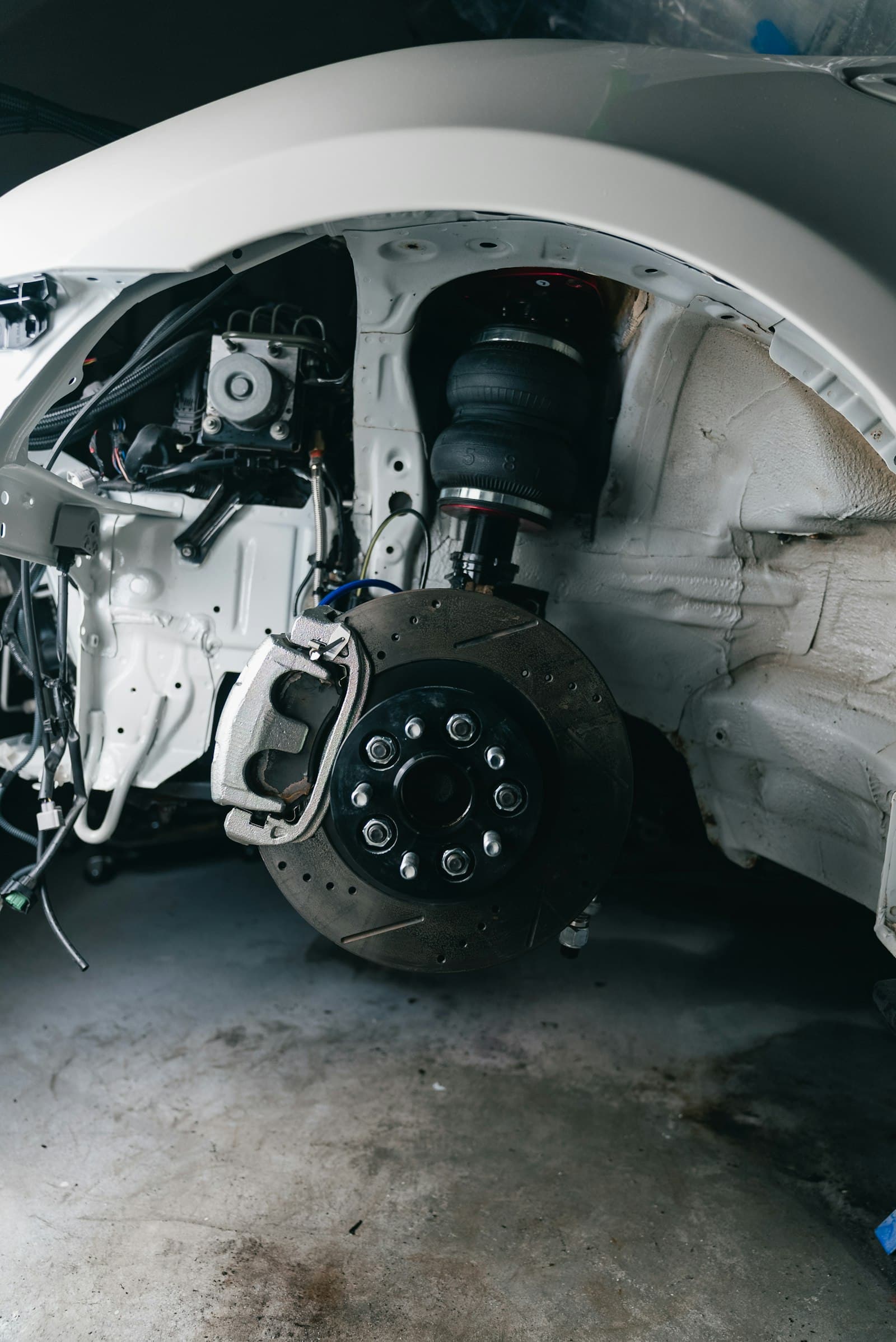 A vehicle's suspension and brake assembly with the wheel removed