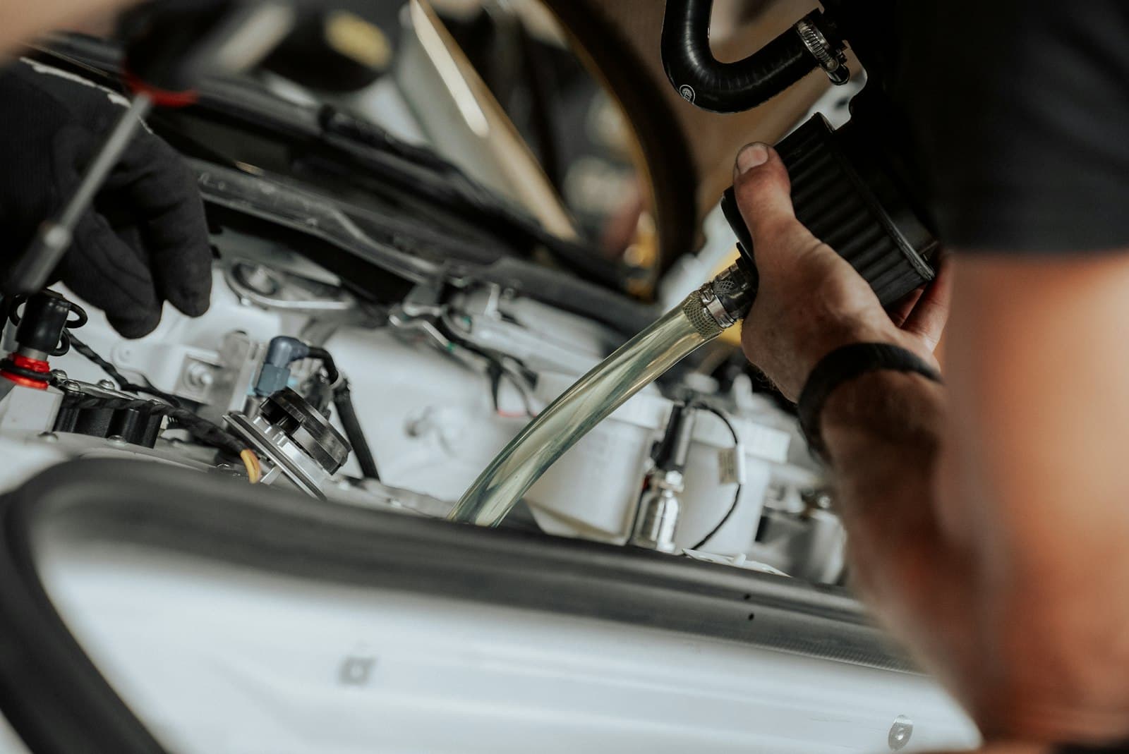 A technician checking a vehicle's air conditioning system