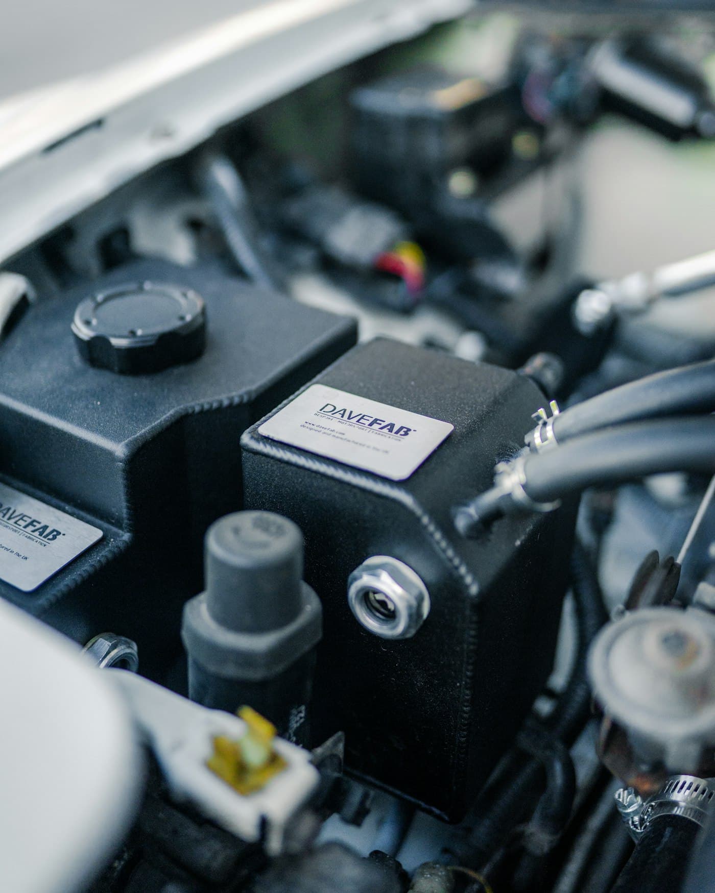 A clean engine bay with fuel and ignition components visible