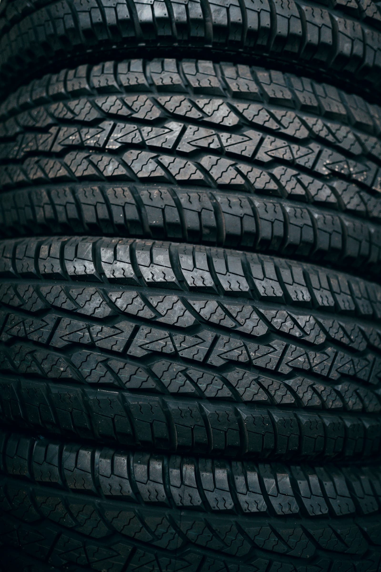Close-up of the tread pattern on a stack of tires